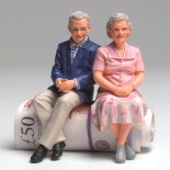 Article thumbnail: Retired couple sitting on roll of UK pounds