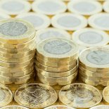 Article thumbnail: British money, new pound coins in three stacks on a background of more money. New one pound coins introduced in 2017; Shutterstock ID 642612709; Purchase Order: -