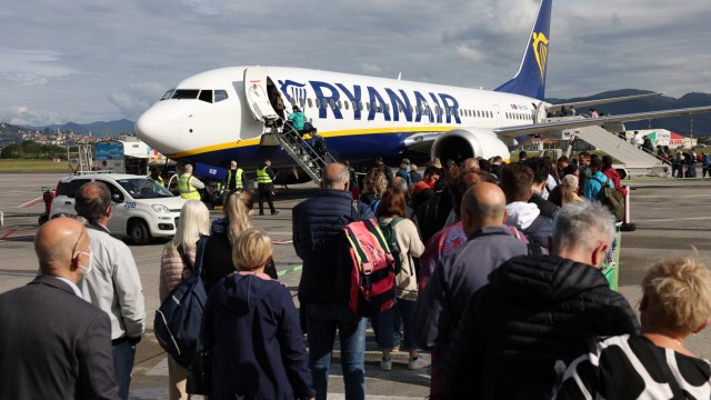 Article thumbnail: ORIO AL SERIO, ITALY - MAY 08: Passengers board Ryanair airplanes at Caravaggio ??? Bergamo Orio al Serio International Airport (BGY) on May 8, 2022 in Orio al Serio near Bergamo, Italy. Primarily fueled by low-cost carriers such as Ryanair, global airline capacity has climbed back to 83 percent of its level in 2019 prior to the coronavirus (COVID-19) pandemic. Additionally, a pan-European mask mandate for passengers on airplanes and in airports will be lifted on May 16, as high vaccinations levels help prevent more serious cases of the virus. (Photo by Adam Berry/Getty Images)