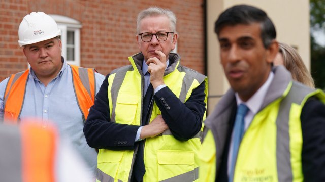 Article thumbnail: Britain's Levelling Up, Communities and Housing Secretary Michael Gove (C) and Britain's Prime Minister Rishi Sunak (R) visits the Taylor Wimpey Heather Gardens housing development in Norwich on August 29, 2023. (Photo by Joe Giddens / POOL / AFP) (Photo by JOE GIDDENS/POOL/AFP via Getty Images)