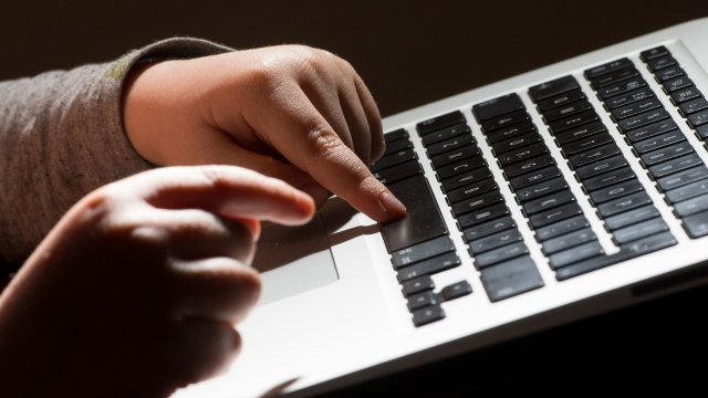 Article thumbnail: EMBARGOED TO 0001 MONDAY NOVEMBER 13 File photo dated 26/05/22 of a child using a laptop computer. Child protection experts have fiercely criticised social media giant Meta over its plans for end-to-end encryption, accusing the tech firm of prioritising profit over children's safety. Head of the National Crime Agency Graeme Biggar said introducing end-to-end encryption on Facebook would be like "consciously turning a blind eye to child abuse". Issue date: Monday November 13, 2023. PA Photo. See PA story CRIME Encryption. Photo credit should read: Dominic Lipinski/PA Wire