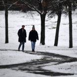 Article thumbnail: Members of the public walk in the snow in Victoria Park in Glasgow on December 2, 2023. (Photo by ANDY BUCHANAN / AFP) (Photo by ANDY BUCHANAN/AFP via Getty Images)