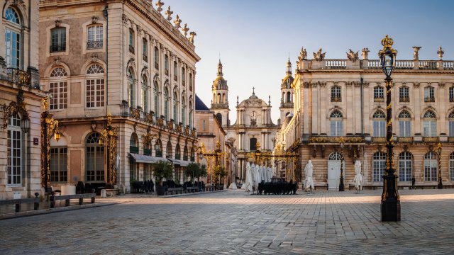 Article thumbnail: Place Stanislas is a classical-style square, located in the center Nancy, in the historic region of Lorraine, listed as a UNESCO World Heritage Site since 1983. The square was built by Stanis??aw Leszczy??ski (Stanislas in French or Stanislaus I - 1677-1766, King of Poland, Duke of Lorraine and Bar) between 1751 and 1755, under the direction of the architect Emmanuel H??r??. The picture is a panoramic view of the South-East corner of the square, with the east entrance, one of the pavillon (housing several cafes) and the town hall. The Our Lady of the Annunciation (Notre-Dame-de-l???Annonciation) cathedral (historical monument) is visible in the background.