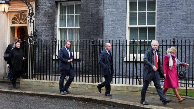 Article thumbnail: Danny Kruger and Miriam Cates, accompanied by other members of the New Conservatives, walk outside 10 Downing Street in London, Britain, December 12, 2023. REUTERS/Hannah McKay