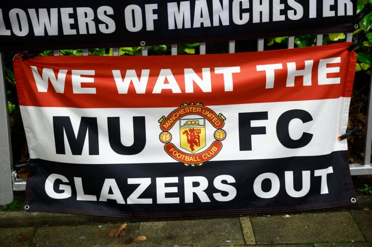 Soccer Football - Champions League - Group A - Manchester United v Bayern Munich - Old Trafford, Manchester, Britain - December 12, 2023 Manchester United banner with a protest against the Glazer family owner of the club Action Images via Reuters/Jason Cairnduff