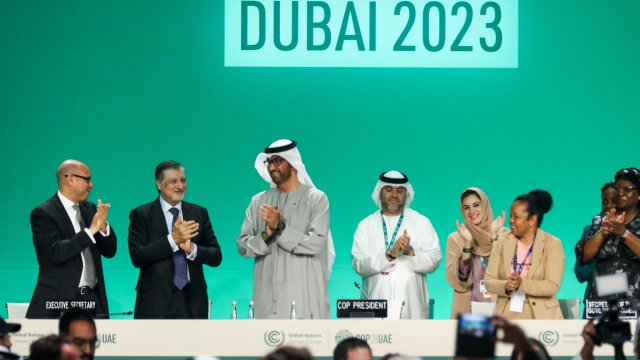 Article thumbnail: DUBAI, UNITED ARAB EMIRATES - DECEMBER 13: Delegates applaud after a speech by Sultan Ahmed Al Jaber (3L), President of the UNFCCC COP28 Climate Conference, during a plenary session on day thirteen of the UNFCCC COP28 Climate Conference on December 13, 2023 in Dubai, United Arab Emirates. The conference has gone into an extra day as delegations continue to negotiate over the wording of the final agreement. The COP28, which was originally scheduled to run from November 30 through December 12, has brought together stakeholders, including international heads of state and other leaders, scientists, environmentalists, indigenous peoples representatives, activists and others to discuss and agree on the implementation of global measures towards mitigating the effects of climate change. (Photo by Fadel Dawod/Getty Images)