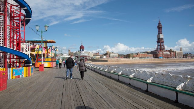 Article thumbnail: Blackpool seafront seen from North Pier England UK. (Photo by: Education Images/Universal Images Group via Getty Images)
