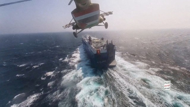 Article thumbnail: FILE PHOTO: Houthi military helicopter flies over the Galaxy Leader cargo ship in the Red Sea in this photo released November 20, 2023. Houthi Military Media/Handout via REUTERS THIS IMAGE HAS BEEN SUPPLIED BY A THIRD PARTY/File Photo