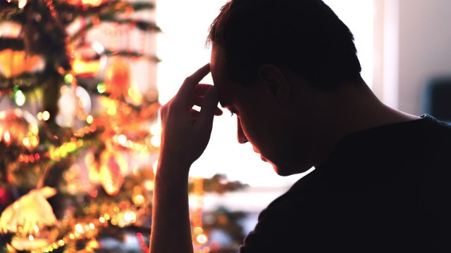 Article thumbnail: Sad on Christmas. Unhappy, lonely or tired man with stress, grief or depression. Family fight, loneliness, frustration or money problem on Xmas. Sick person with flu, pain and headache on holiday