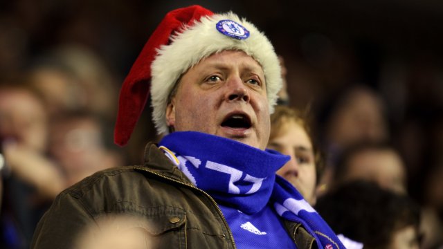 Article thumbnail: A fan of Chelsea dressed in a Santa hat (Photo by AMA/Corbis via Getty Images)
